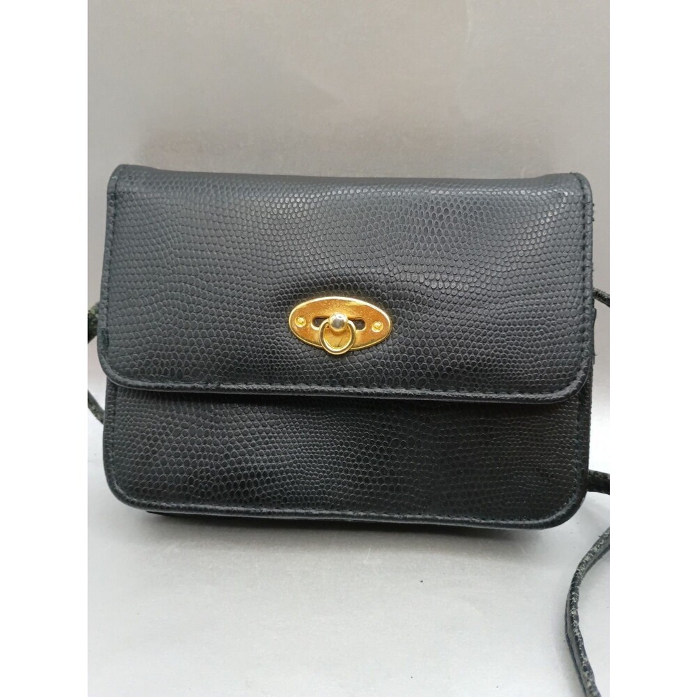 black textured leather with distinctive gold-tone Read Description